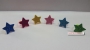 Anillos estrella purpurina 6u
