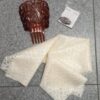 Peineta , broche, mantilla crema infantil